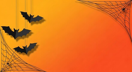 Three hanging black paper bats on left, empty copy space on right, orange backdrop.