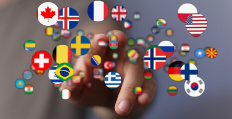 Hand reaching out to a collection of international flags symbolizing global connections, diversity,...