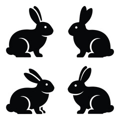 Four black silhouette rabbits posed in different angles simple cute easter spring animal icon graphic design element silhouette
