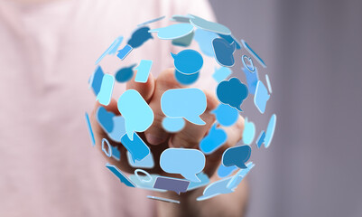 Person holding digital speech bubbles. Symbolizes communication, globalization, social media, and online conversations. Connection and interacti