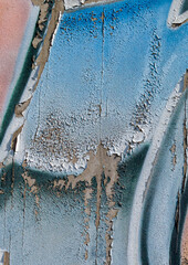 cracked and peeling paint on a wall surface. The weathered texture shows layers of faded blue and white paint flaking off, revealing an aged and distressed background. Perfect as a grunge overlay.