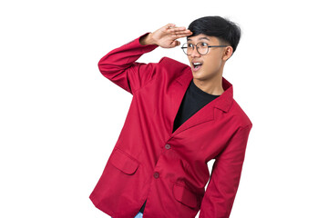 Young college student looking far away keeping hand on forehead isolated on white background