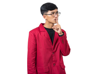 Young college student shushing gesture with finger on lips isolated on white background