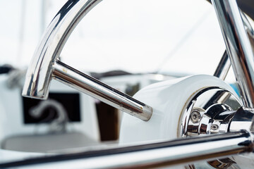 steering wheel on a yacht © larisikstefania