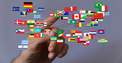 A hand reaching out to touch a network of interconnected country flags, symbolizing global...