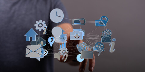 Hand interacting with digital icons representing global network, technology, and connection.