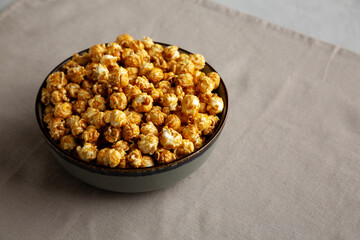 Homemade Caramel Pop Corn in a Bowl, low angle view. Copy space.
