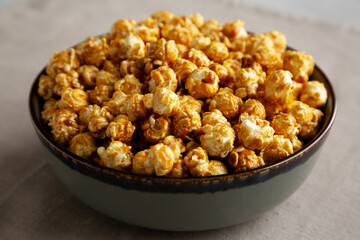 Homemade Caramel Pop Corn in a Bowl, low angle view. Close-up.