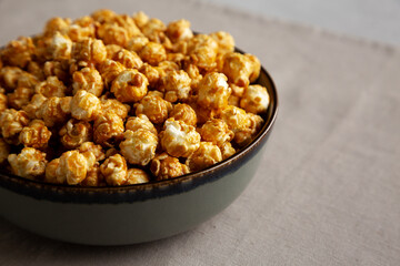 Homemade Caramel Pop Corn in a Bowl, low angle view. Copy space.