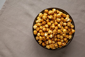 Homemade Caramel Pop Corn in a Bowl, top view. Space for text.