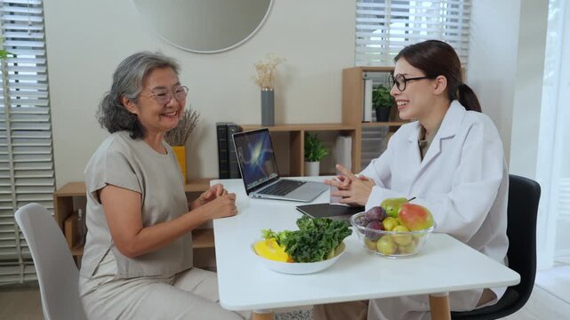 Elderly nutrition consultant caregiver meeting for diet guidance and food support clinic visit, warm caregiver and nutritionist advice reviews balanced meal plan with fresh produce, empathetic
