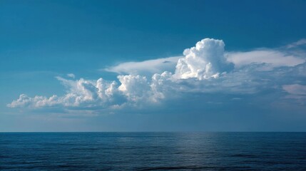 Naklejka premium Tranquil ocean water under cloudy sky, deep and serene scene.