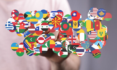 A hand gently holding a collection of world flags, symbolizing global unity, cooperation, and the...