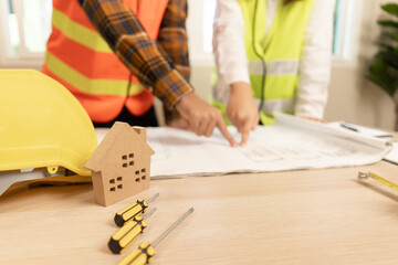 Engineers team and owner discuss check and review the blueprint of construction. Contractor inspection drawing before start project civil. project planning, consulting, architecture.