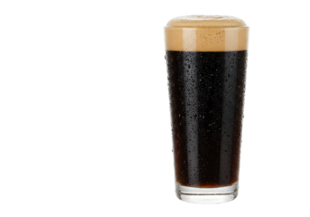 Isolated pint glass of dark beer with foamy head ready to serve and enjoy refreshingly