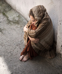 Frozen girl sitting on the floor