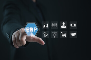 Executive touching digital ERP system interface with icons for analytics, finance, human resources, supply chain, and business process integration, representing corporate management technology.