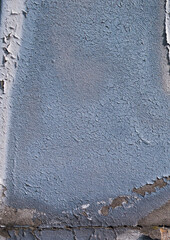 cracked and peeling paint on a wall surface. The weathered texture shows layers of faded blue and white paint flaking off, revealing an aged and distressed background. Perfect as a grunge overlay.