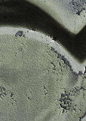cracked and peeling paint on a wall surface. The weathered texture shows layers of faded blue and white paint flaking off, revealing an aged and distressed background. Perfect as a grunge overlay.
