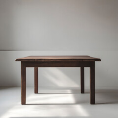 Wooden table against a white wall