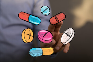 Stock photo of hand interacting with colorful pills and capsules.  Perfect for healthcare, medicine, and pharmacy concepts.
