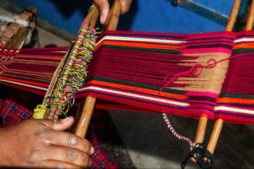 The weaving hands of a woman from the village of Tupe, laborious craftsmanship, with great patience and creativity, bring the fabrics to life. Tupe, Yauyos, Perú.