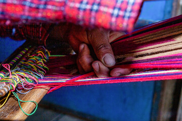 The weaving hands of a woman from the village of Tupe, laborious craftsmanship, with great patience and creativity, bring the fabrics to life. Tupe, Yauyos, Perú.