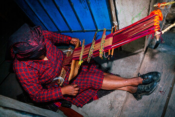 The weaving hands of a woman from the village of Tupe, laborious craftsmanship, with great patience and creativity, bring the fabrics to life. Tupe, Yauyos, Perú.