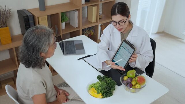 Nutrition consultants provide relaxed guidance on senior nutrition plans with AI charts, personalized recommendations, and a bowl of fresh fruits and vegetables to support a balanced diet.