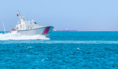 Coast Guard patrol boat rushing to the rescue