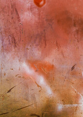 old graffiti wall with faded paint, deep scratches, and visible signs of wear and tear. The surface shows layers of spray paint, peeling texture, and rough markings, creating a gritty urban background