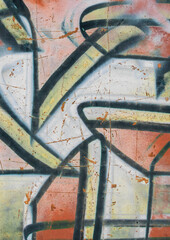 graffiti artwork on a textured wall surface. Colorful spray paint with black lines, faded tones and weathered marks create an urban grunge background. Ideal as a graffiti overlay, street art texture.