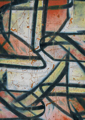 graffiti artwork on a textured wall surface. Colorful spray paint with black lines, faded tones and weathered marks create an urban grunge background. Ideal as a graffiti overlay, street art texture.