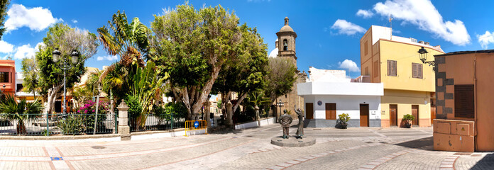 Historic center of Agüimes with the bell tower of San Sebastián Church and a charming town square
