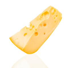 Close-up of a wedge of Swiss cheese with characteristic holes, isolated on a white background. Tasty dairy product for culinary design, menu decoration, food advertising, recipe.