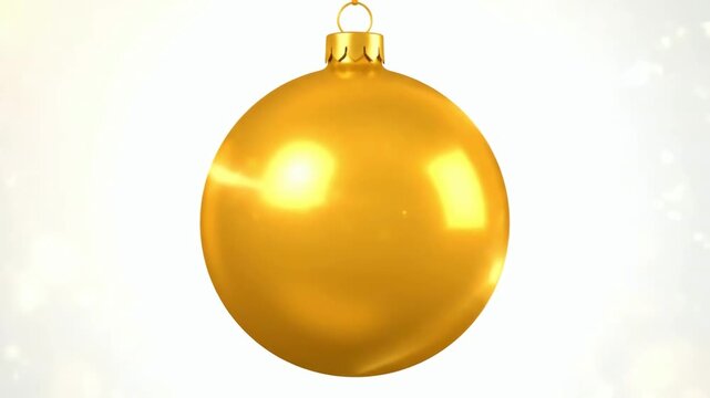 A golden bauble spins slowly against a shiny background. This movement represents expectation, cyclical change, a symbolic ornament, and a festive atmosphere.