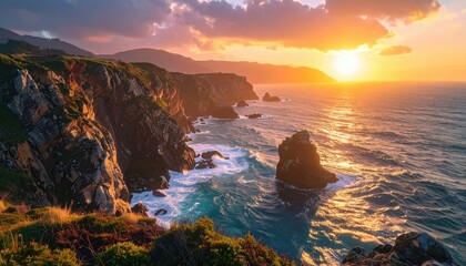 Obraz premium A stunning coastal landscape at sunset, showcasing rugged cliffs, crashing waves, and a vibrant sky, creating a serene and picturesque natural scene.