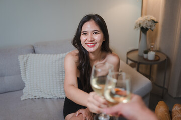 Happy woman toasting wine celebrating special private moment