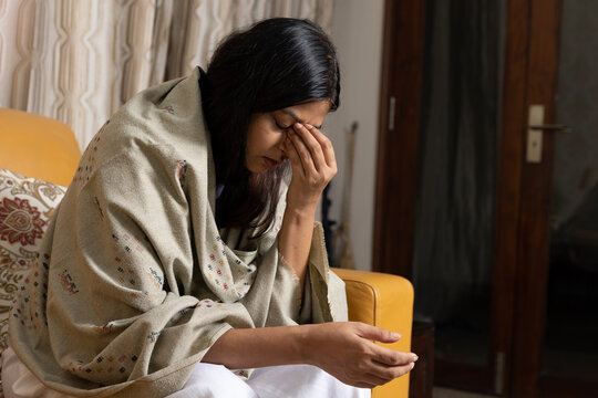 Indian young woman feels unhappy, suffering from insomnia, sad and disappointment about problem in personal life. Depression or unexpected pregnancy and having problems sleeping