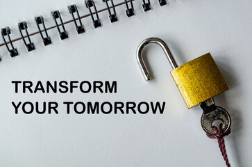 TRANSFORM YOUR TOMORROW, Inspirational notepad with padlock and key symbolizing change and...