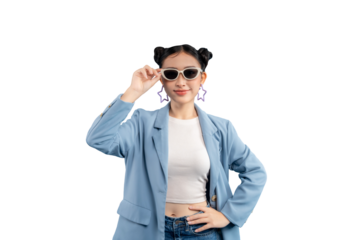Young woman in a stylish outfit. She is wearing sunglasses and has two buns hairstyle