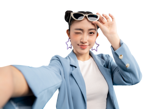 Stylish young Asian woman taking a selfie, winking and wearing sunglasses and a blazer on PNG