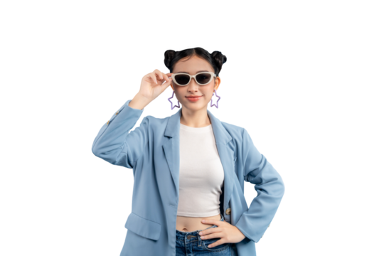 Young woman in a stylish outfit. She is wearing sunglasses and has two buns hairstyle