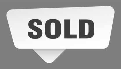 sold sign. sold white sticker isolated on gray background