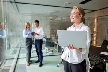 Business team meeting in modern office setting with engaged professionals