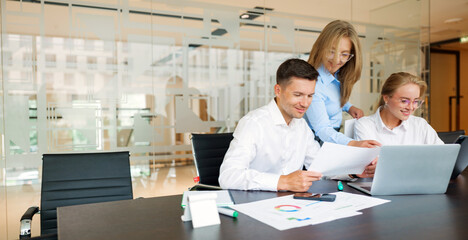 Team collaboration on business project in modern office setting