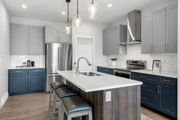 Kitchen with a white counter and blue cabinets
