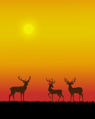 A serene sunset scene with three silhouetted deer standing in a field of grass, against the vibrant orange yellow sky.