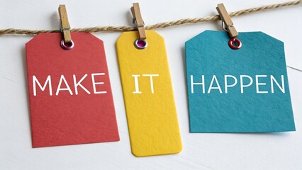 Colorful sign paper tags spelling words 'MAKE IT HAPPEN' isolated on white background