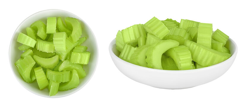 fresh celery in ceramic bowl isolated on white background. Top view. Flat lay